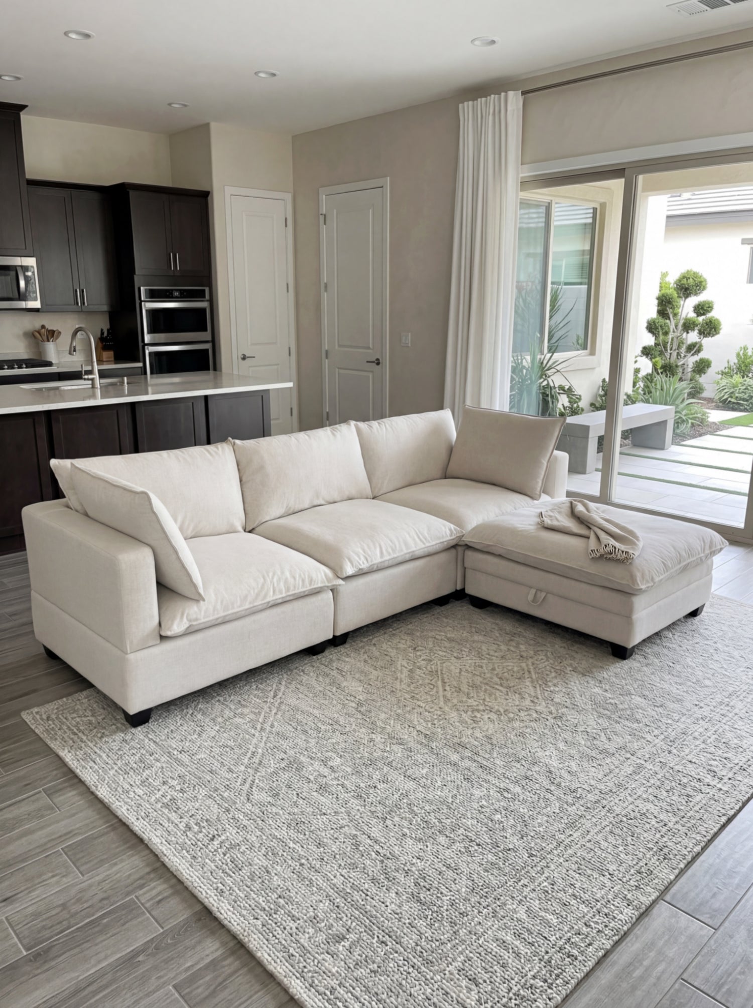 Light cream modular sectional with chaise and squared arms, plush upholstery