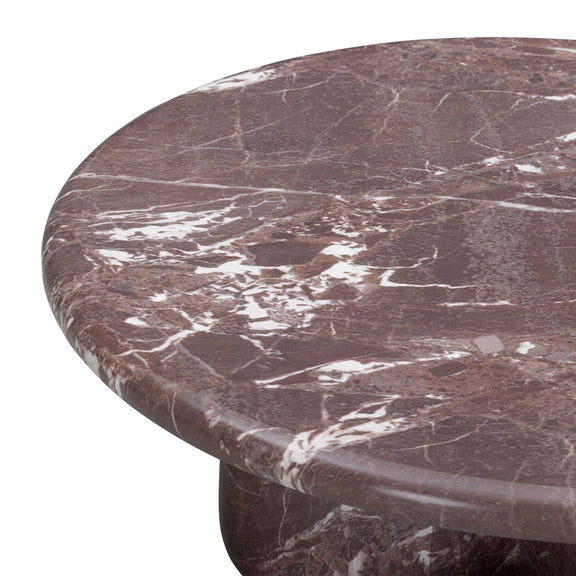 Close-up of dark red marble-look coffee table top with white veining