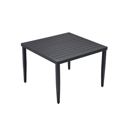 Black patio dining table with square slatted top and four tapered legs