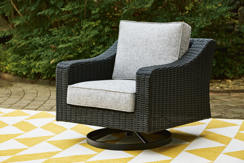 Black wicker swivel lounge chair with light gray seat cushion and upright backrest.