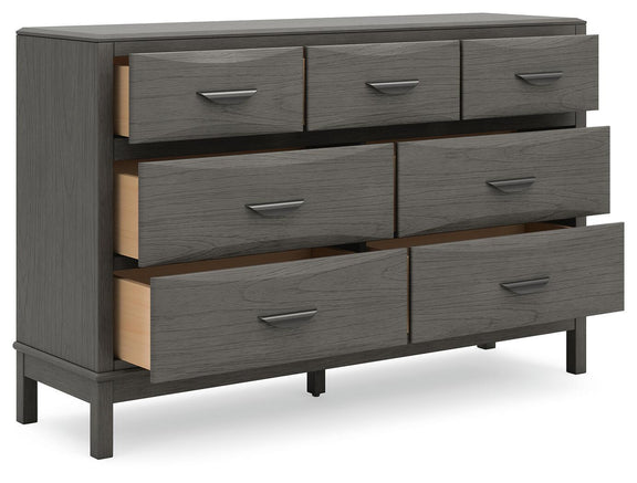 Gray dresser side view with eight drawers and metal bar handles