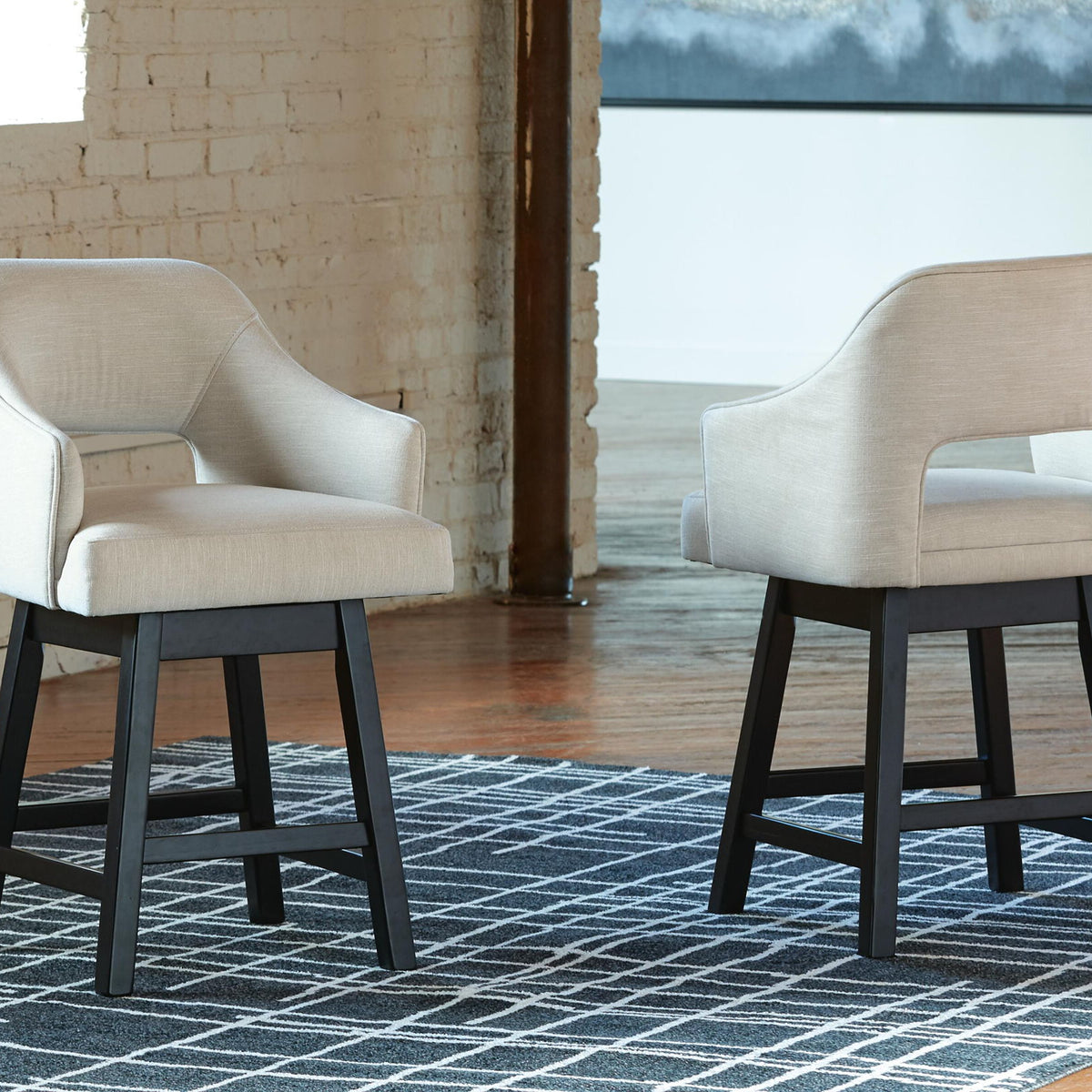 Beige upholstered swivel barstool pair with padded seats and dark wooden bases