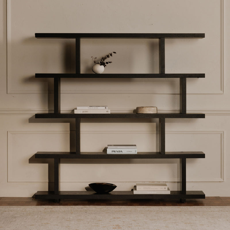 Large black five-tier shelf styled with books and decorative objects.