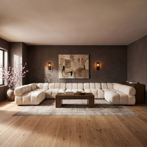 White U-shaped modular sectional sofa with cushioned seat and rounded armrests