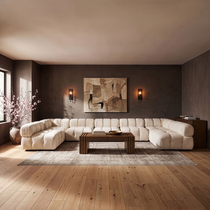 White U-shaped modular sectional sofa with cushioned seat and rounded armrests