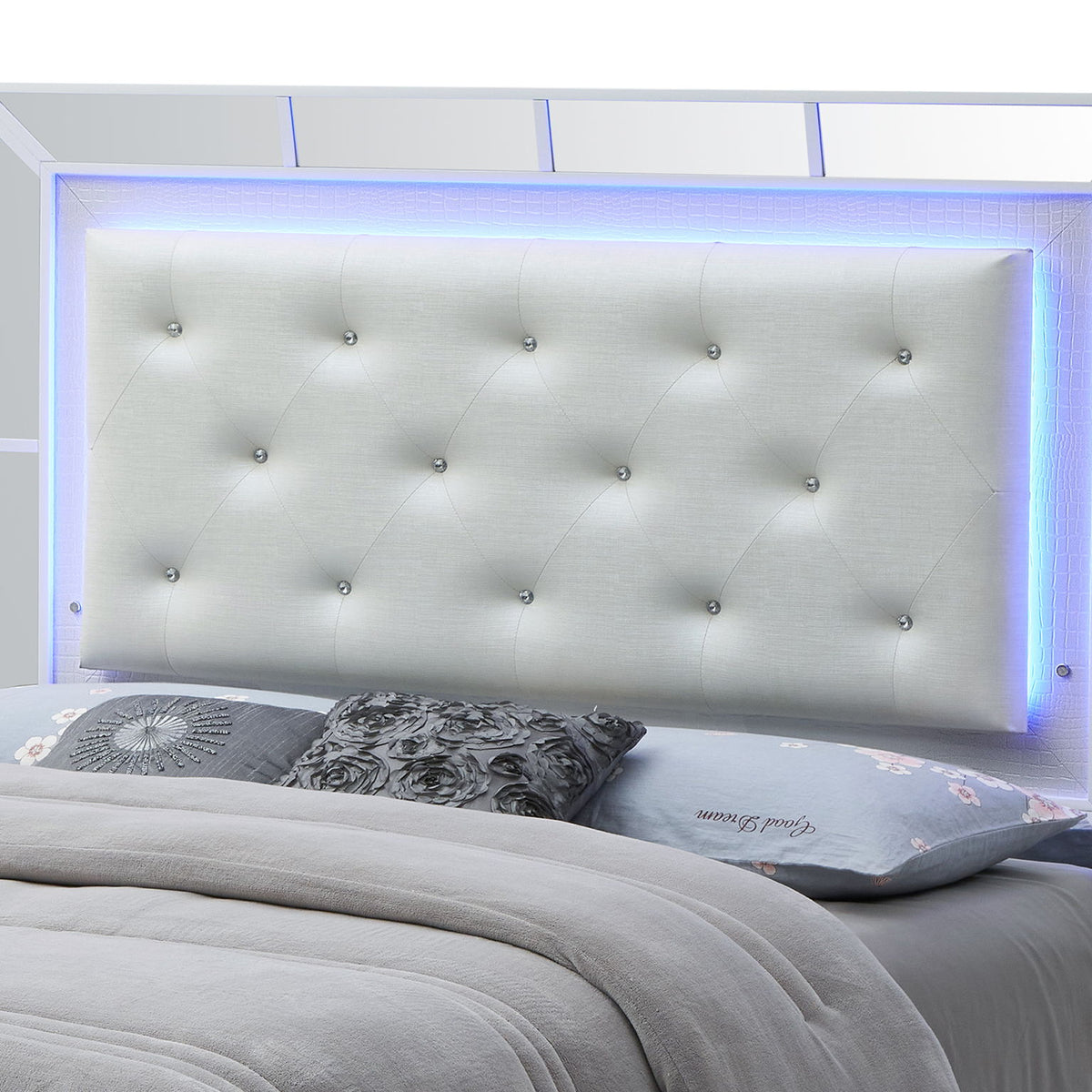 Tufted upholstered queen bed with light-gray headboard and side rails, white frame
