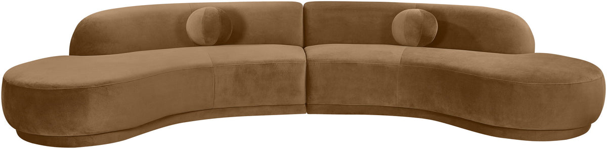 Light brown velvet sectional sofa with tufted cushions and curved chaise profile