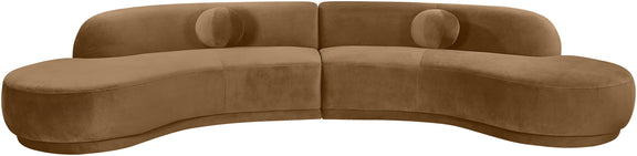 Light brown velvet sectional sofa with tufted cushions and curved chaise profile