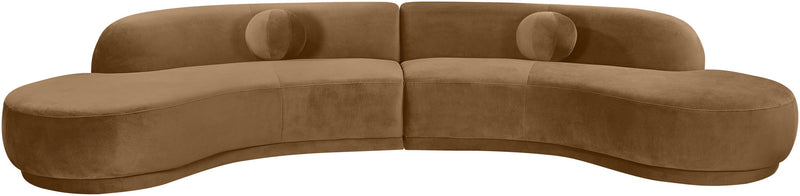 Light brown velvet sectional sofa with tufted cushions and curved chaise profile