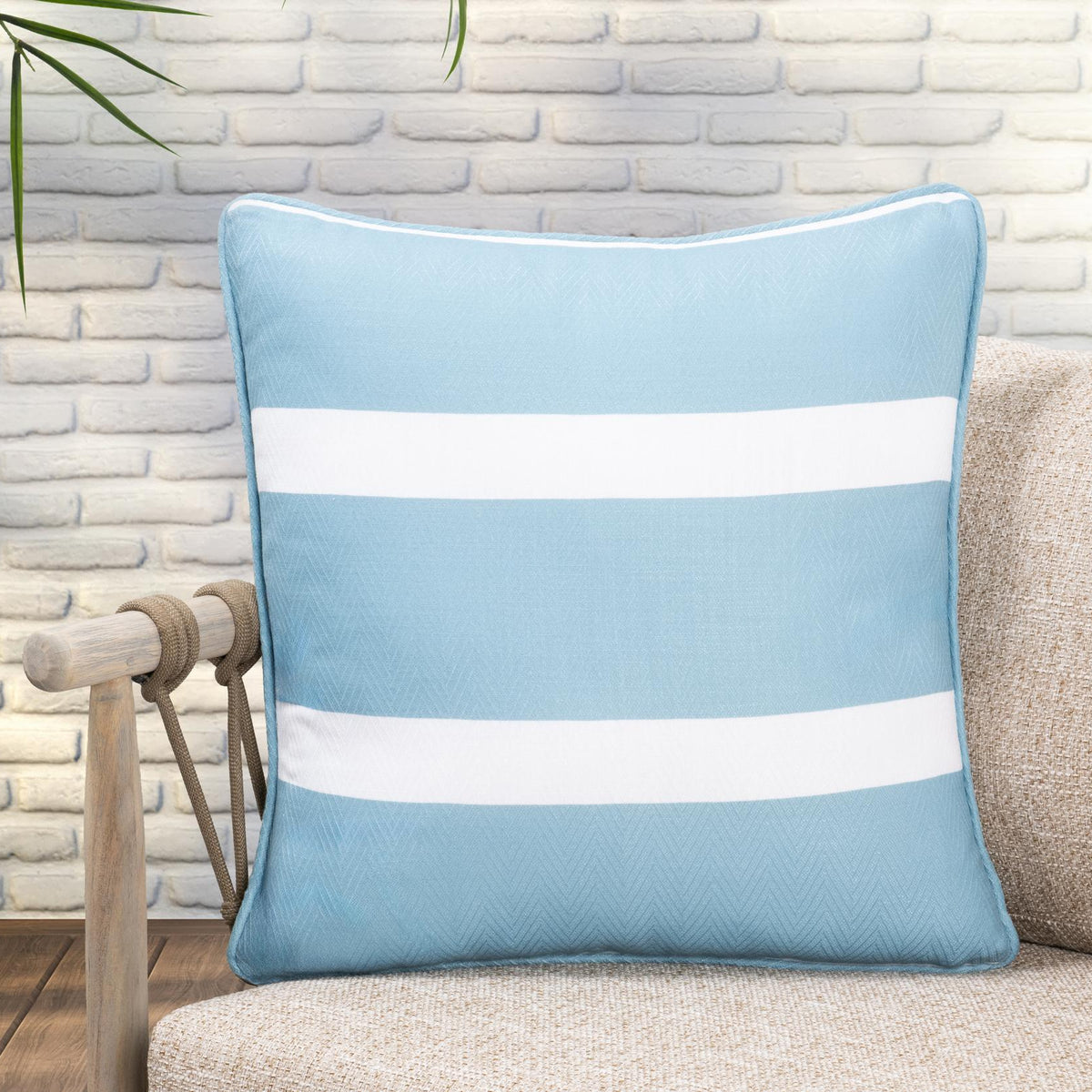 Blue and white striped square throw pillow with piped border