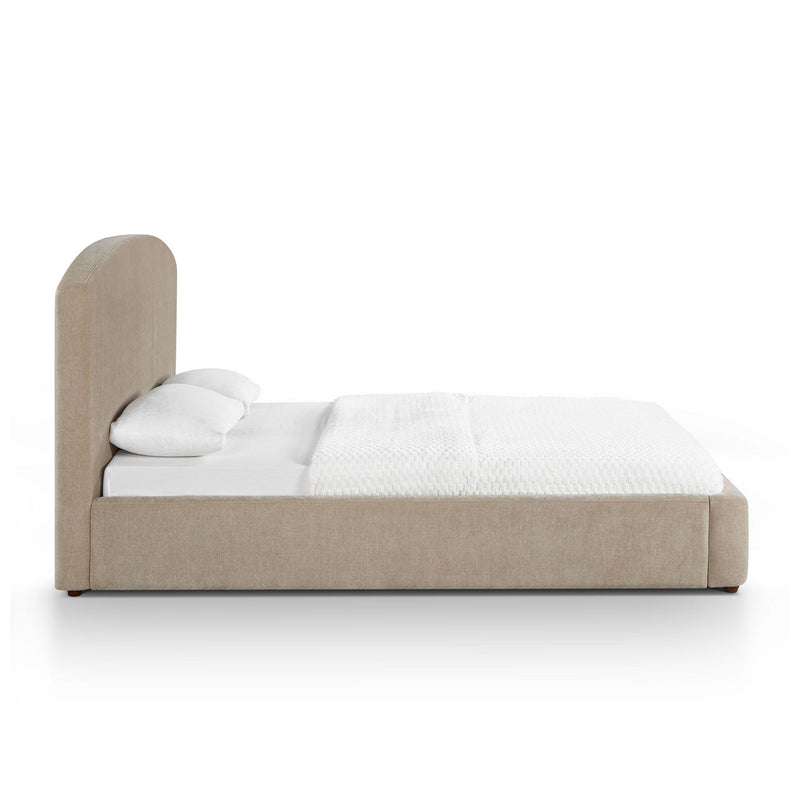 Light brown upholstered platform bed with rounded headboard and white bedding