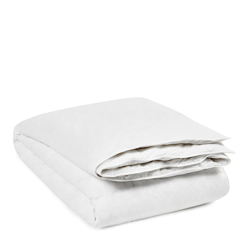 White goose down duvet insert folded into a compact stack