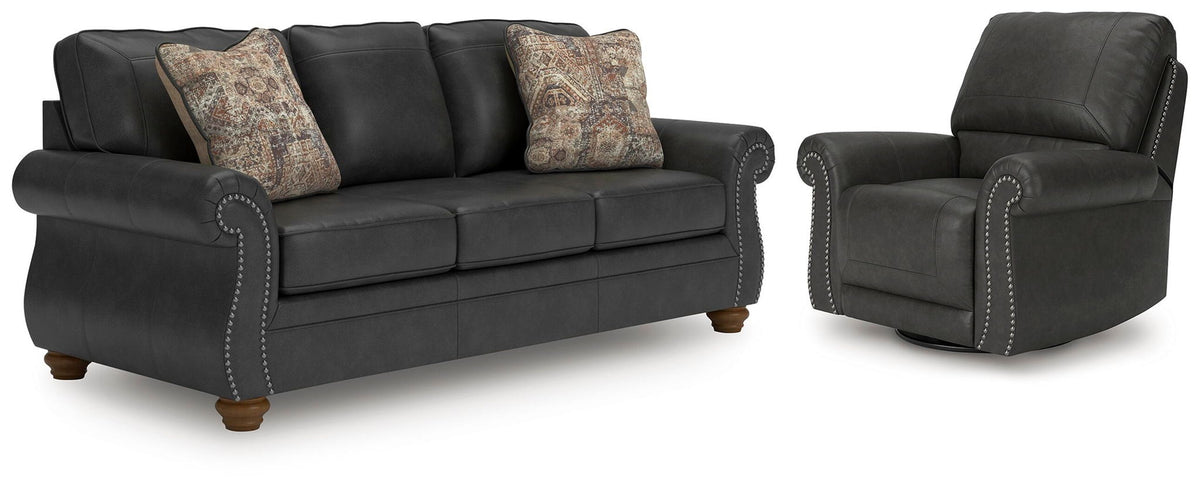 Living room set with dark gray sofa and recliner, button-tufted trim, patterned pillows