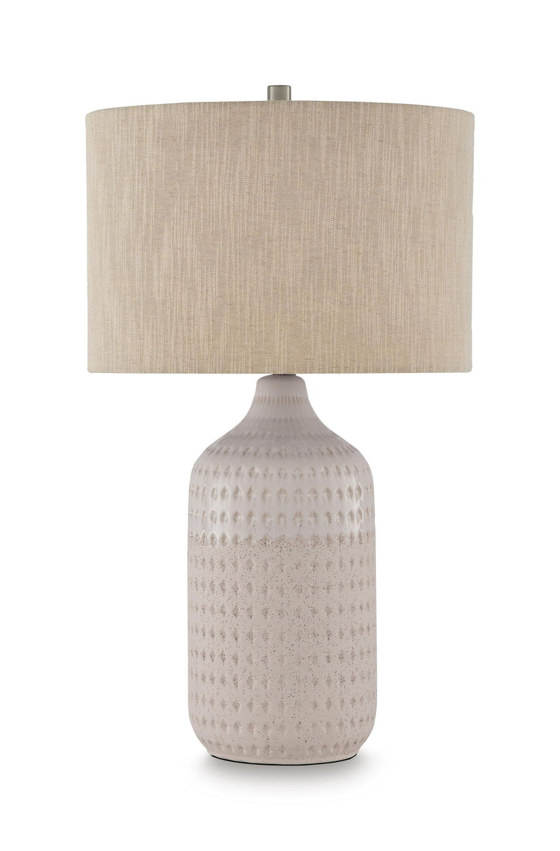 Beige ceramic table lamp with textured white base and beige fabric shade