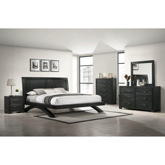 Black panel bedroom set with bed, dresser, mirror, chest, and nightstands.