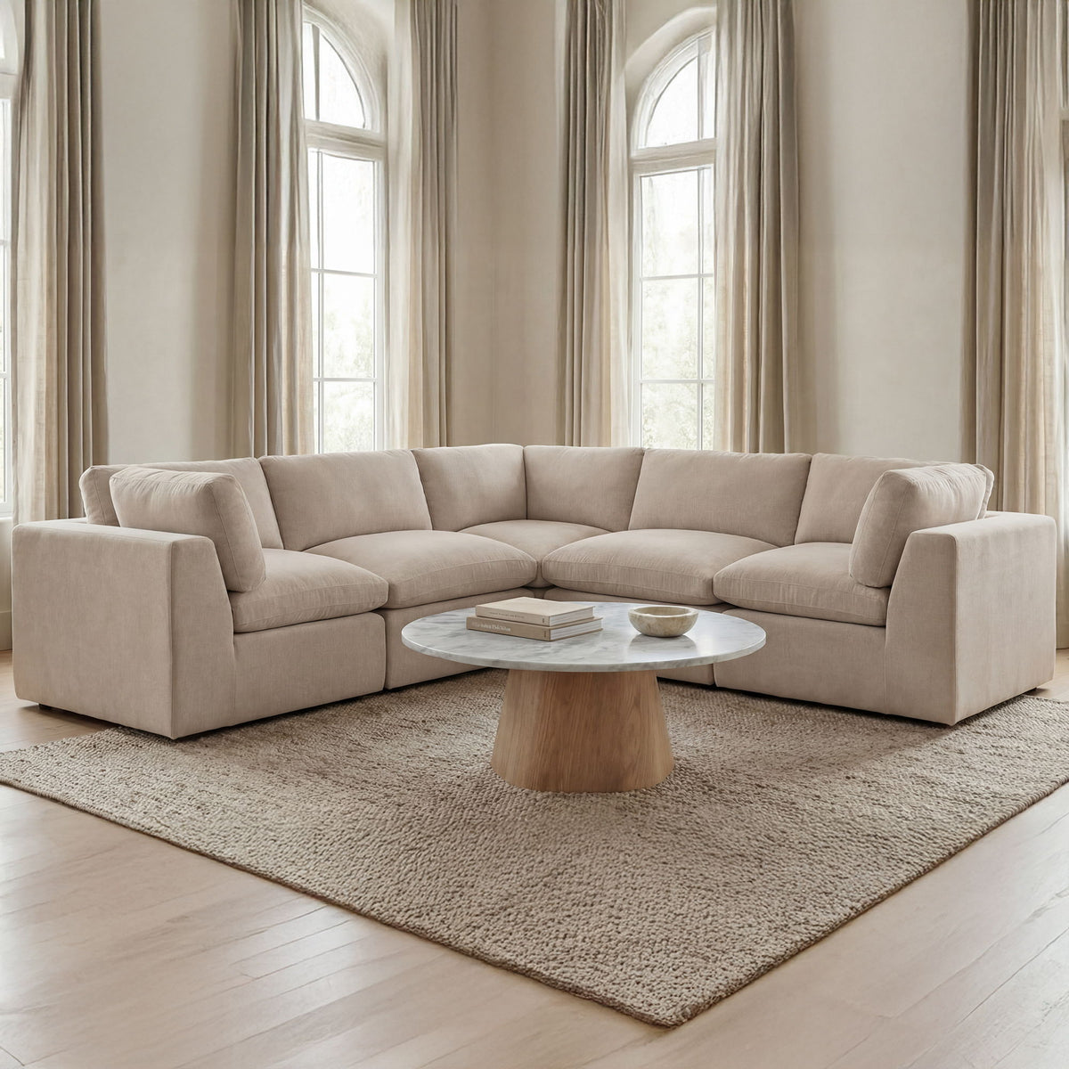 Light beige L-shaped corner sectional sofa with padded arms and deep seat cushions