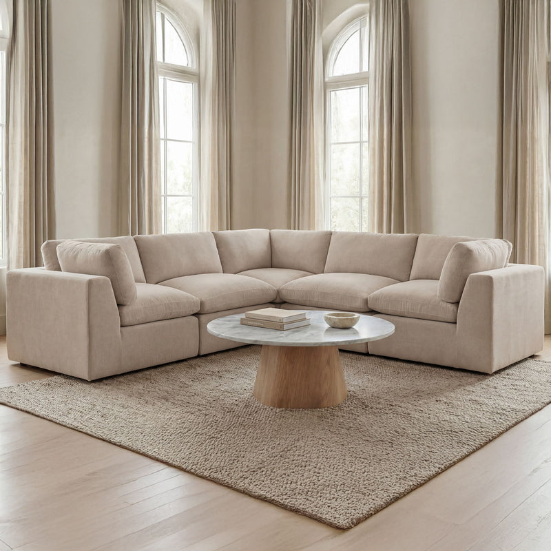Light beige L-shaped corner sectional sofa with padded arms and deep seat cushions