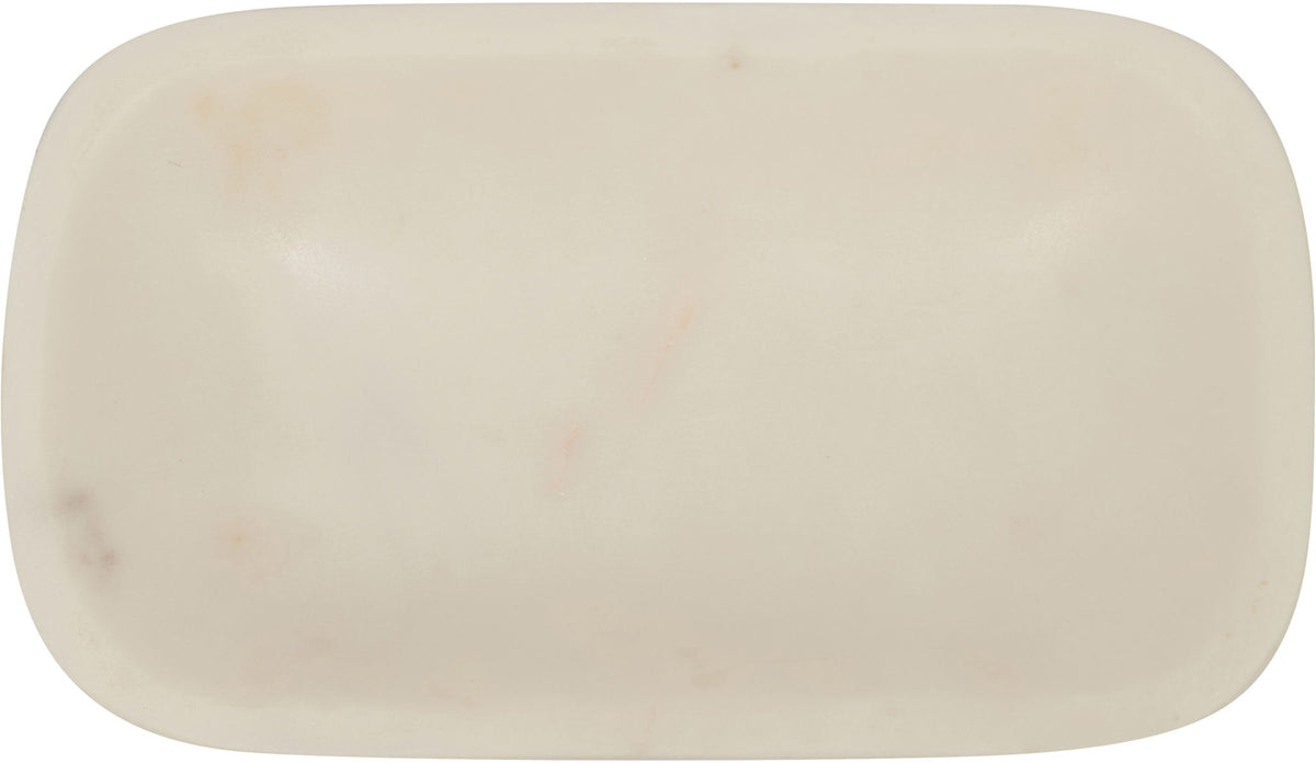 White marble tray close-up, smooth oval dish with subtle spots
