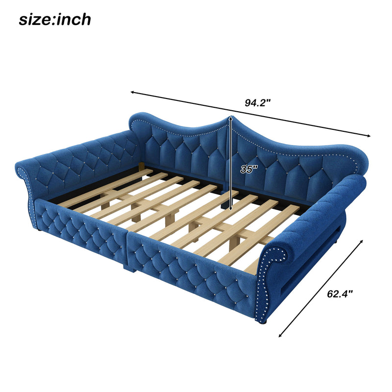 Blue upholstered daybed with tufted panels and slatted mattress platform