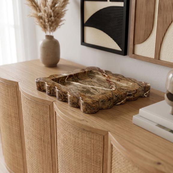 Light brown genuine marble tray on a wooden console with carved scalloped rim
