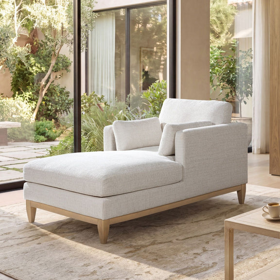 Light beige fabric chaise lounge chair with tufted-style back cushions