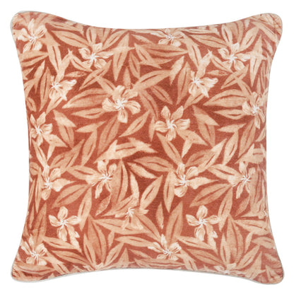 Square pillow with a clay-toned tropical leaf and cream flower print
