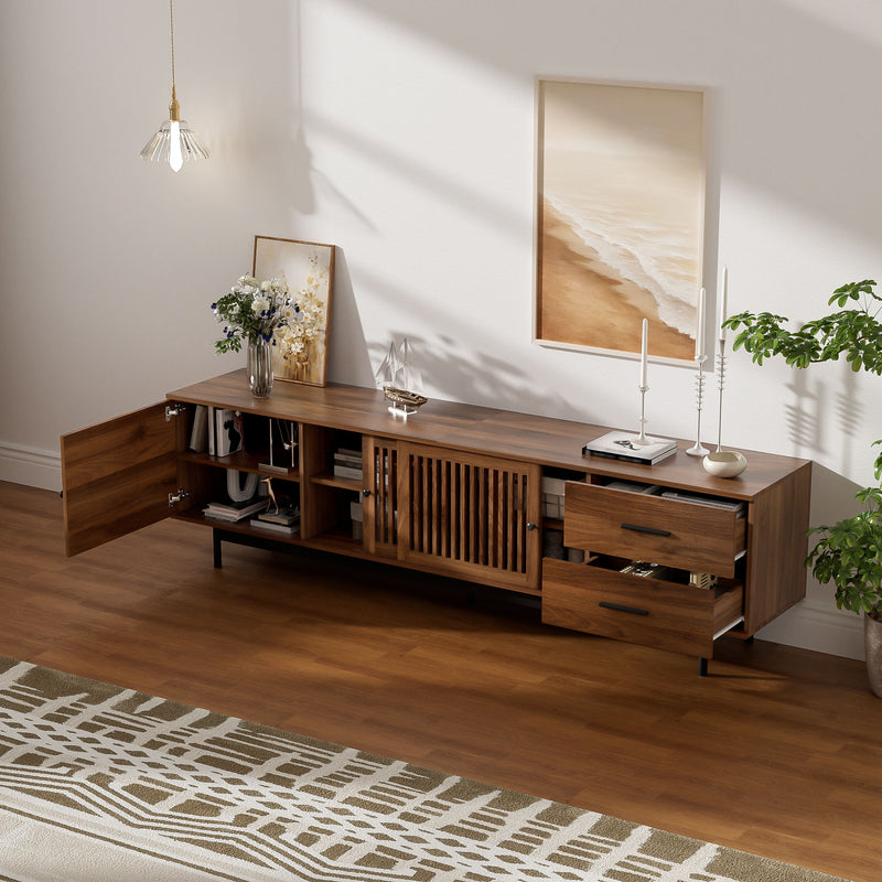 Walnut TV media console with slatted doors, open cubbies, and two side drawers