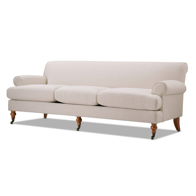 Light beige three-cushion sofa with rolled arms and wooden legs, upholstered upholstery.