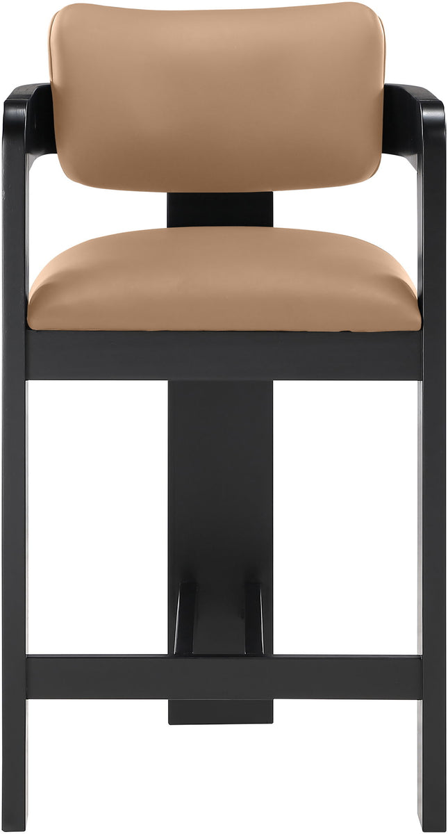 Tan vegan leather counter stool close-up with curved backrest and black frame