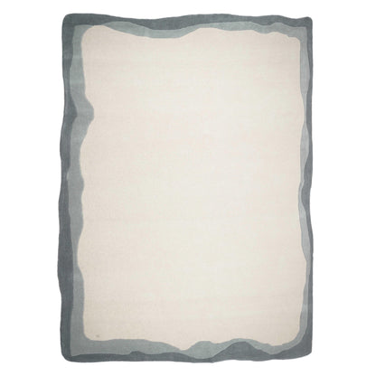 Cream rectangular floor rug with dark gray wavy border and tonal outline