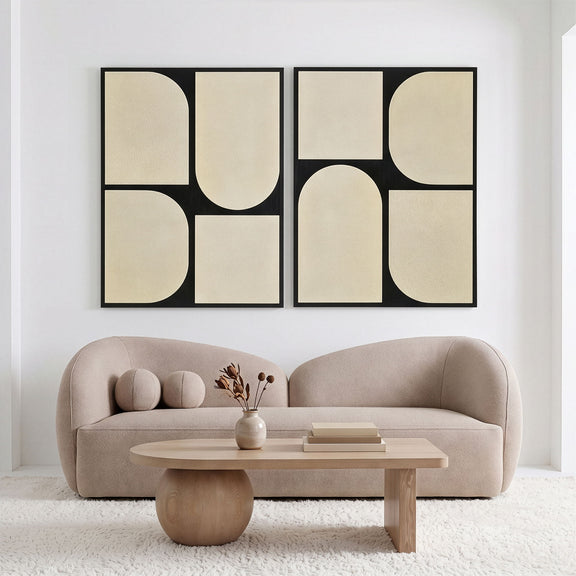 Two-piece wall art set with black frames and beige abstract rounded panels.