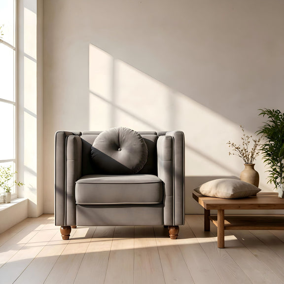 Gray tufted square-arm accent side chair in a living room setting