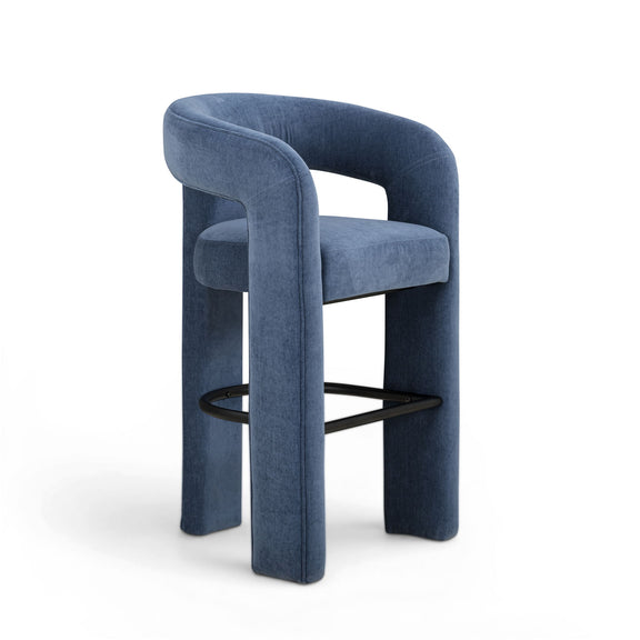 Blue upholstered stool angled view with curved back and black footrest