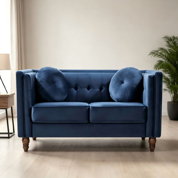 Blue 2-seater velvet loveseat with tufted back and round accent pillows