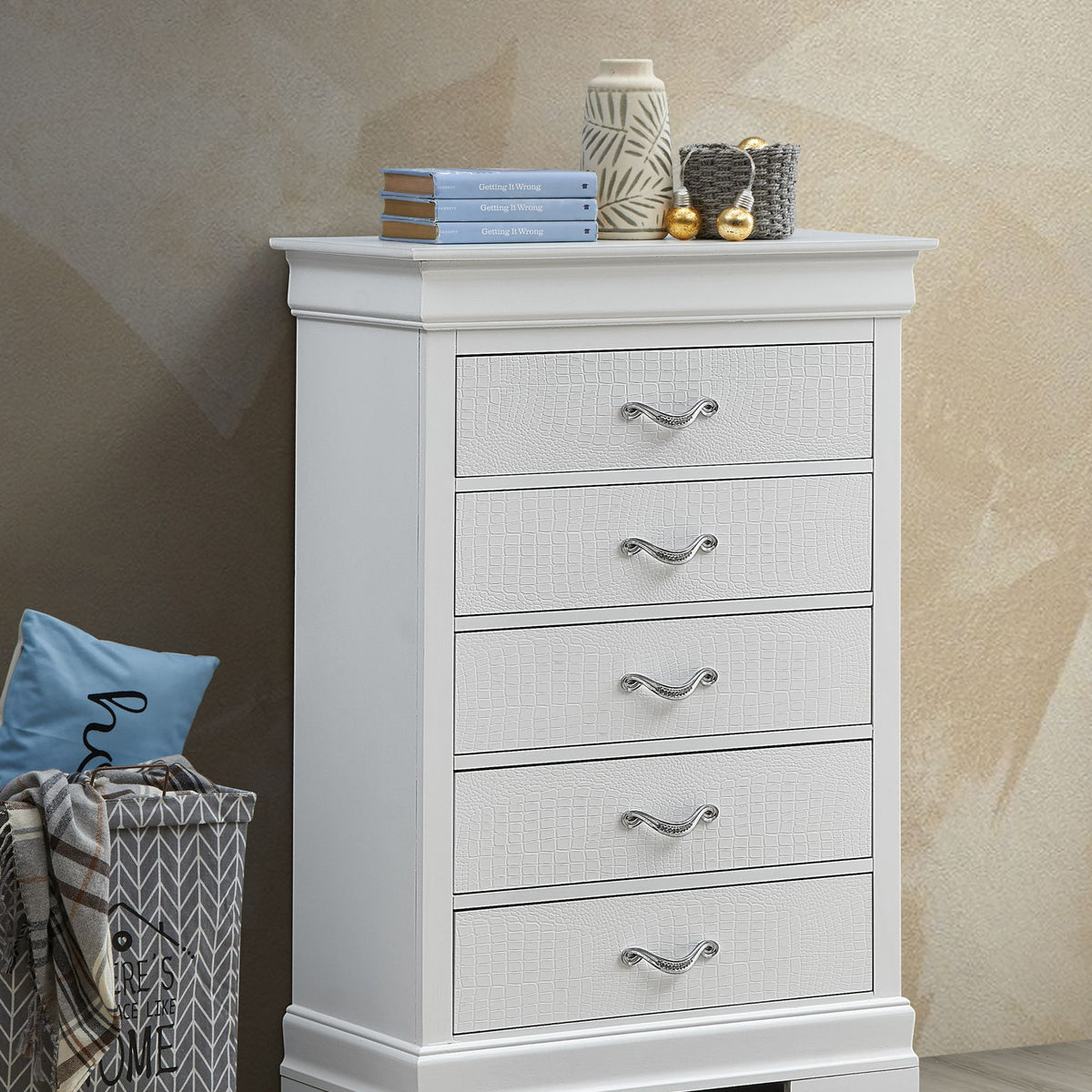 White chest of drawers with 4 textured drawers and curved silver metal handles