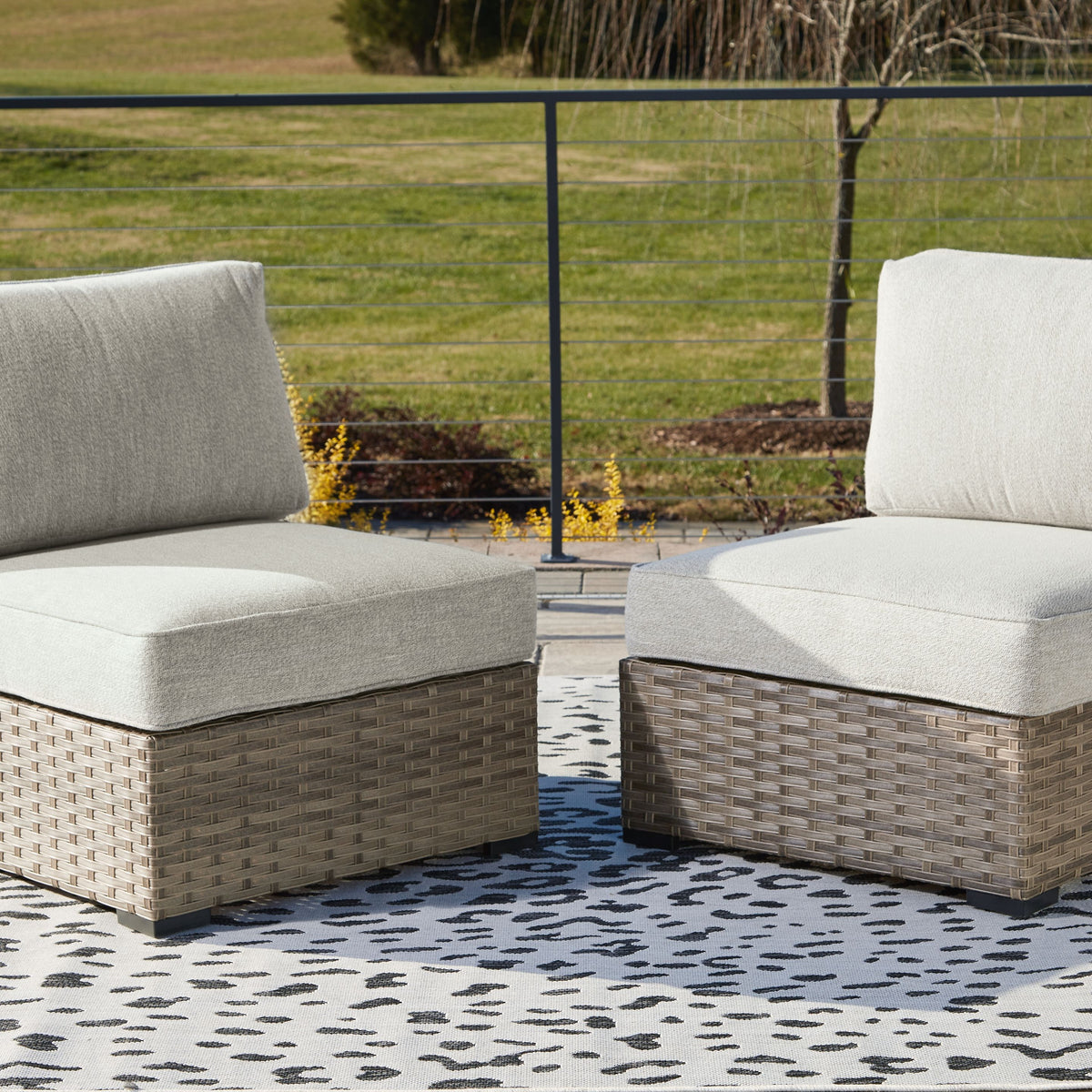 Calworth - Beige - Armless Chair w/Cushion (Set of 2)