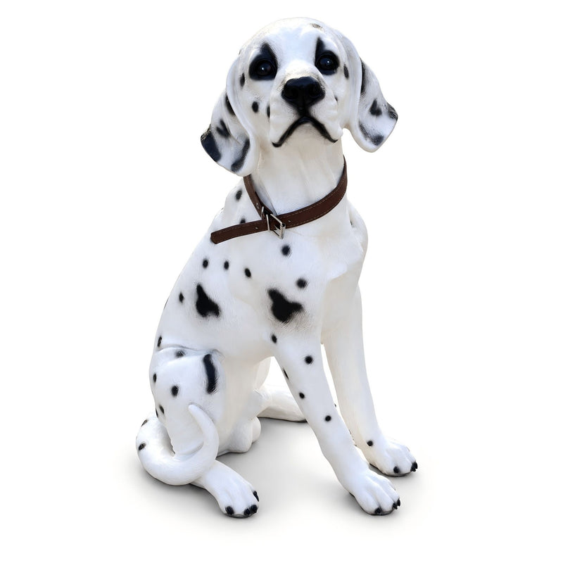 Sitting Dalmatian dog statue with black spots, white finish, and brown collar