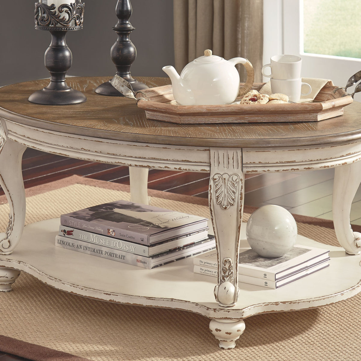Realyn - Oval Cocktail Table - White / Brown