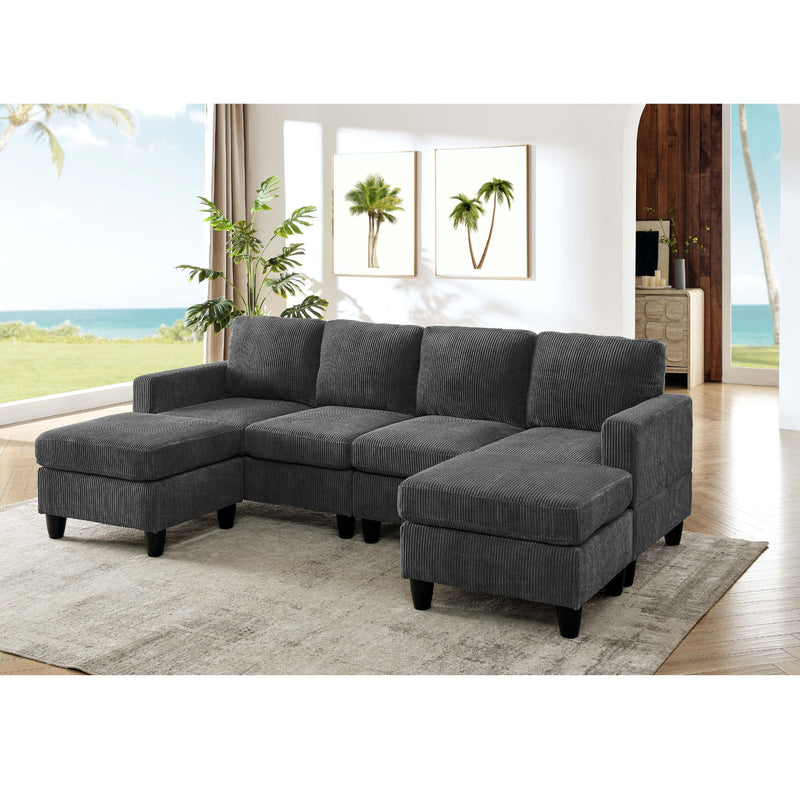 Dark gray modular sectional sofa with two ottomans, padded arms, and tufted cushions