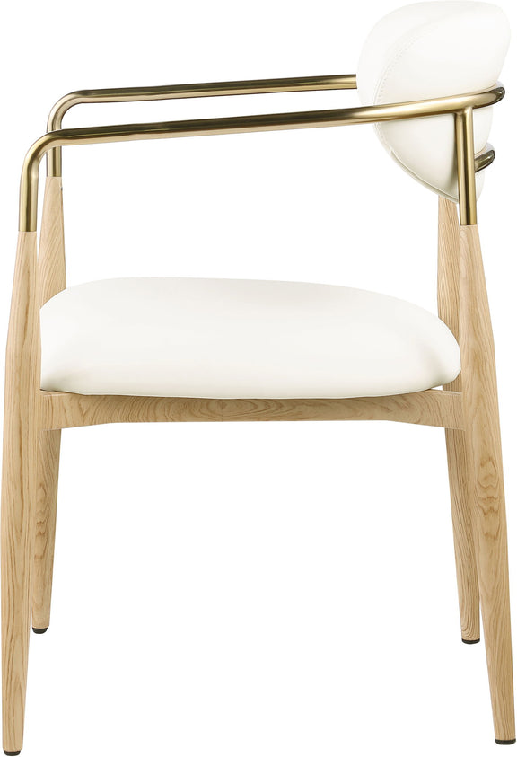 Dining arm chair in white with gold-tone arm supports and light wood legs