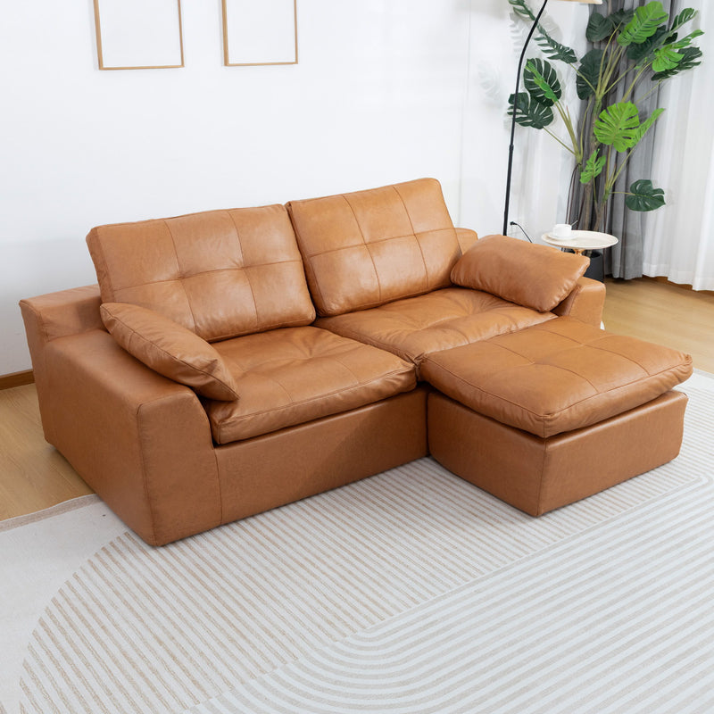 L-shaped 2-seater sofa with movable ottoman, orange fabric cushions.