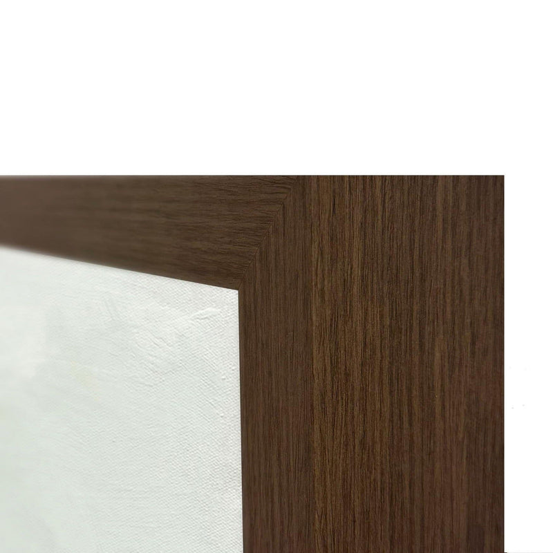 Dark brown wood picture frame corner with visible grain and canvas edge