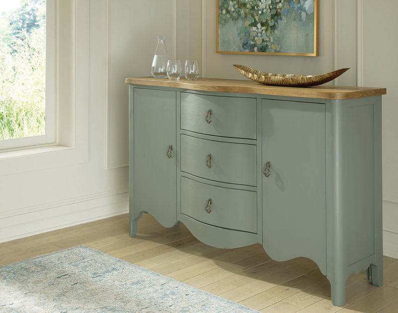 Antique green accent cabinet with scalloped apron, three drawers, brass knobs
