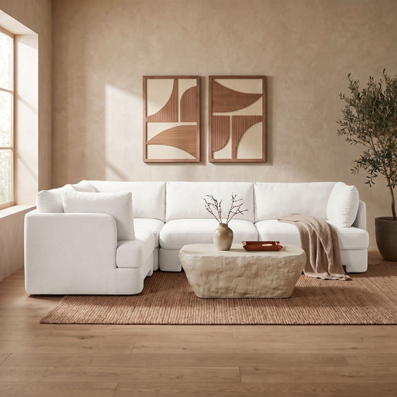 White velvet sectional sofa set with cushioned arms and seat sections