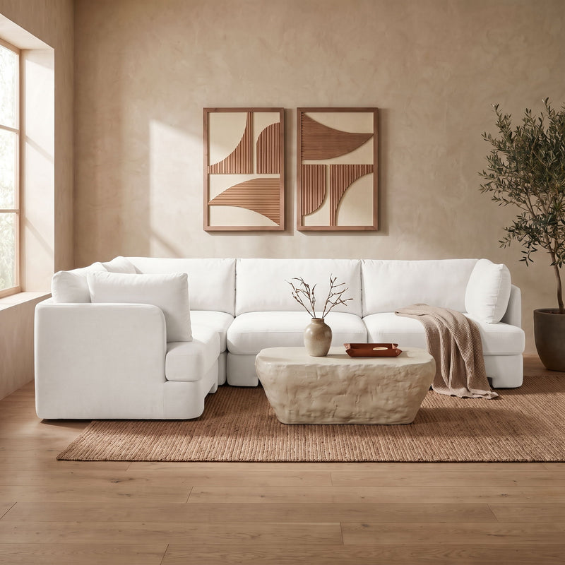 White velvet sectional sofa set with cushioned arms and seat sections