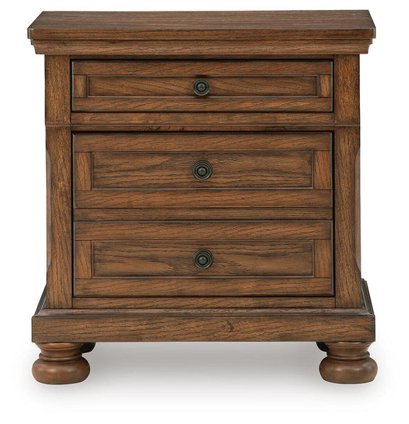 Warm brown wooden nightstand with three drawers, round metal knobs, turned legs