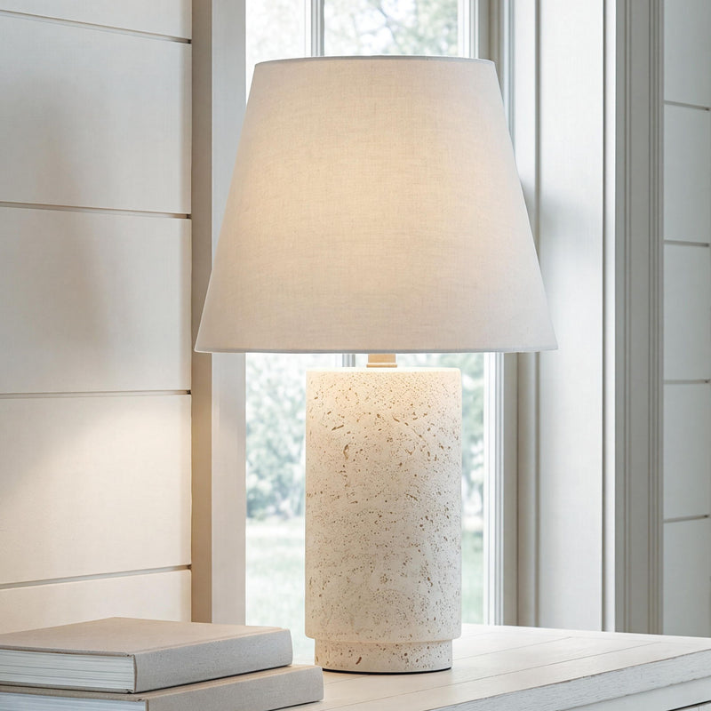 Bronnerdale table lamp with off-white drum shade and speckled beige cylindrical base