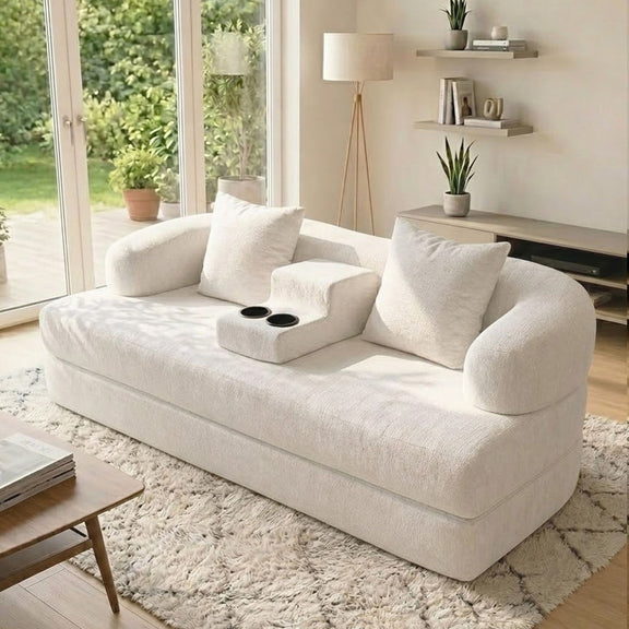 White convertible sleeper sofa bed with three back cushions and center cup holder tray