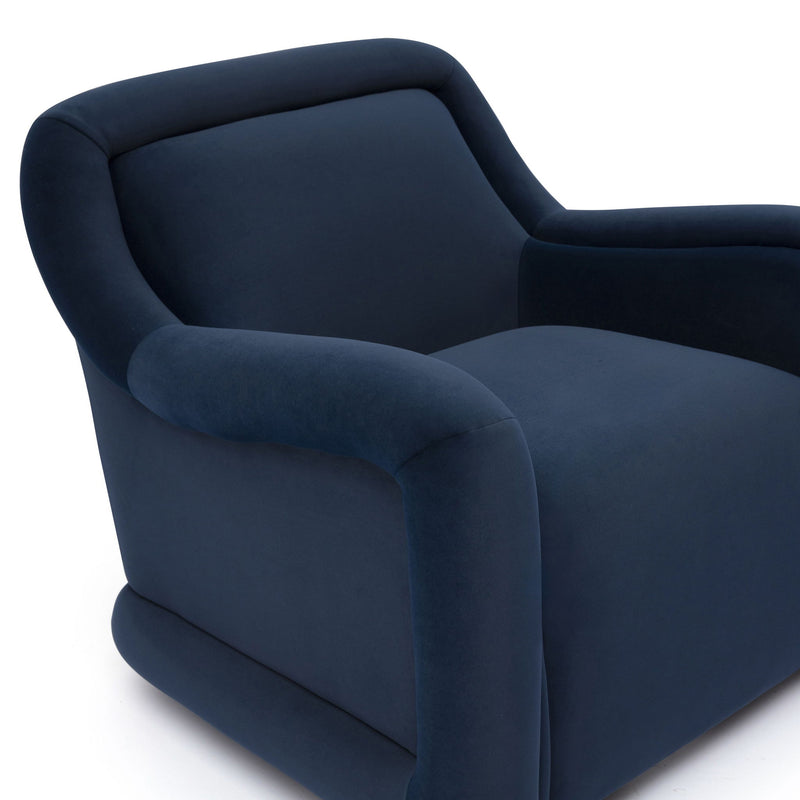 Dark blue upholstered swivel chair with curved arms and wide seat cushion.