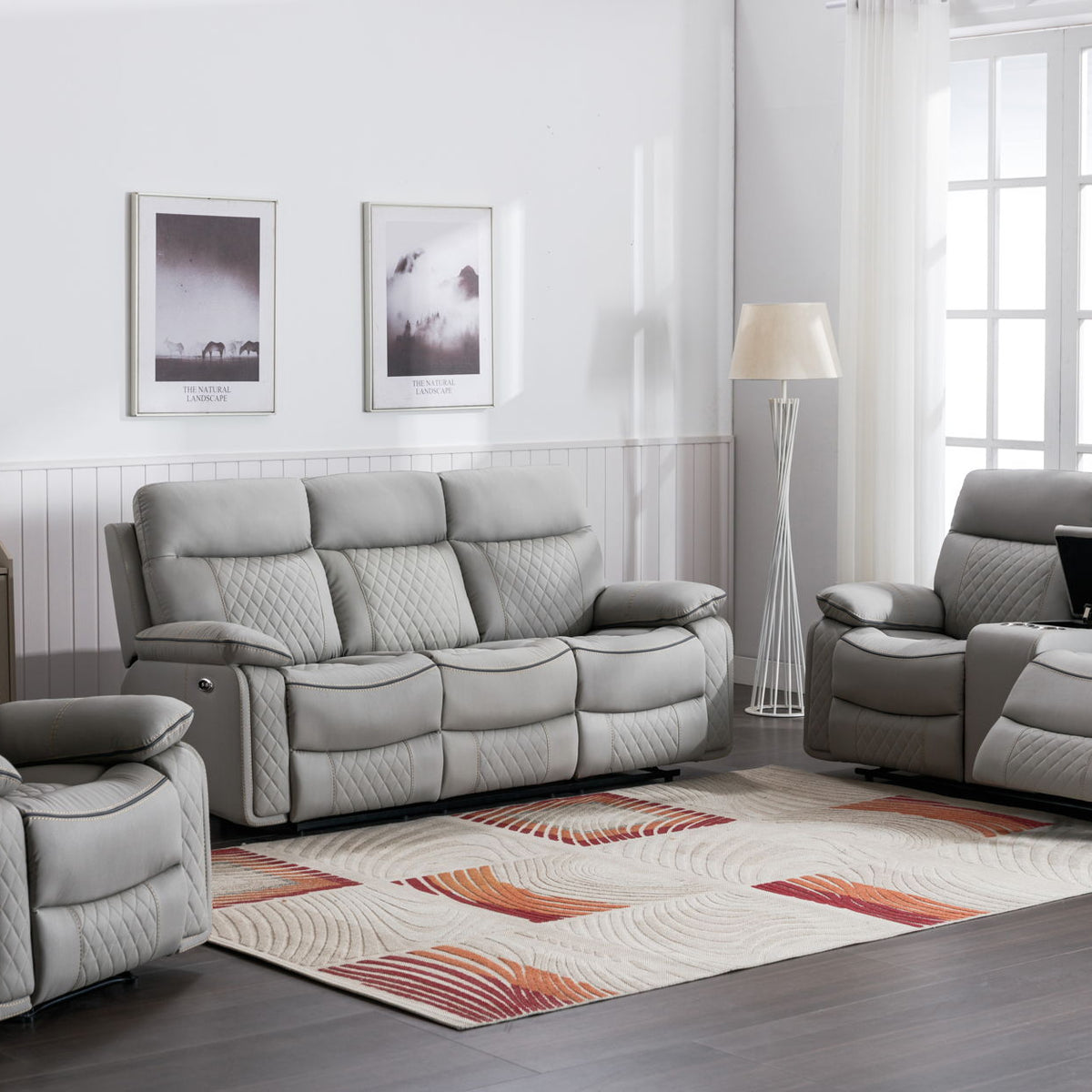 Gray reclining armchair with tufted back cushions and padded armrests